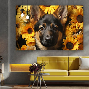 Leinwandbild Schäferhundwelpe vor Sonnenblume Querformat
